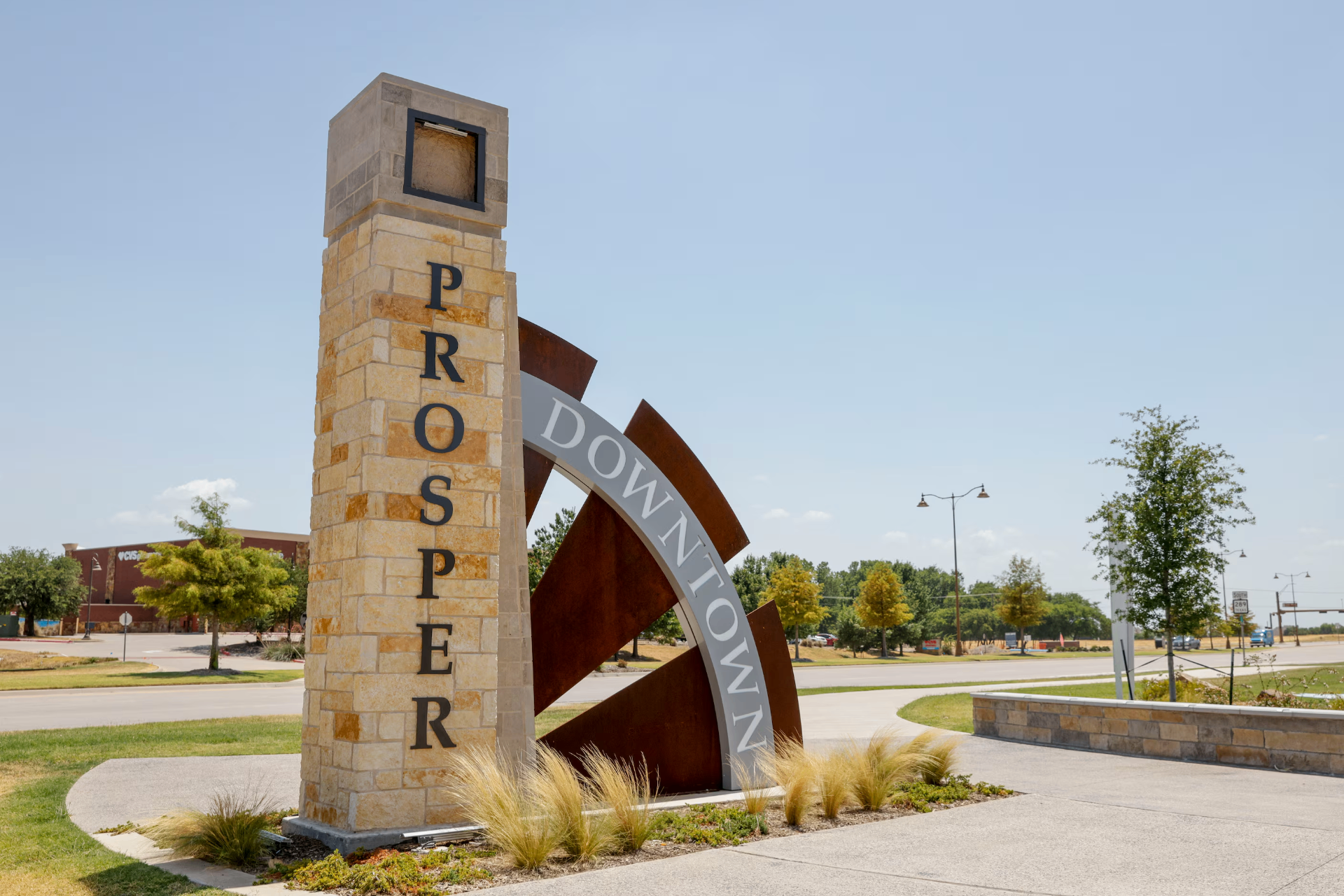 Downtown Prosper welcome sign on a quiet main street